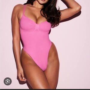 skims pink bodysuit